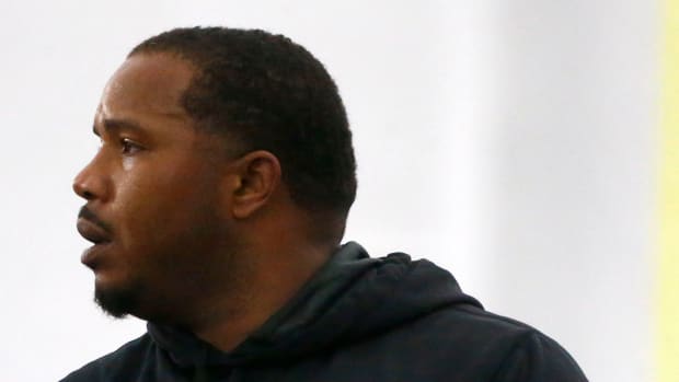 Running Backs coach Sean Dawkins speaks with his team during spring practice Tuesday, March 22, 2022, at the Billy J. Murphy Athletic Complex.